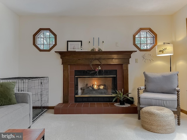 sitting room featuring carpet flooring and a fireplace