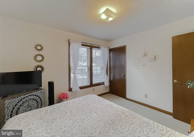 bedroom with light colored carpet