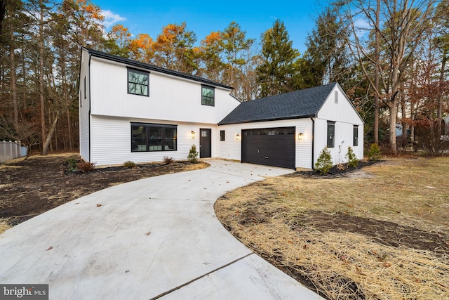 view of front facade with a garage and concrete driveway