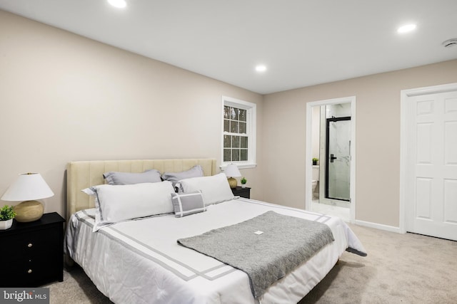 carpeted bedroom with ensuite bath, baseboards, and recessed lighting