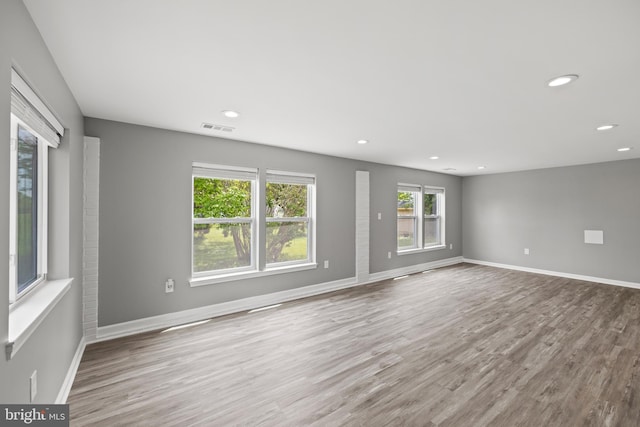 unfurnished room with light wood-type flooring