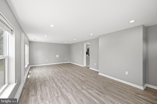 spare room featuring wood-type flooring