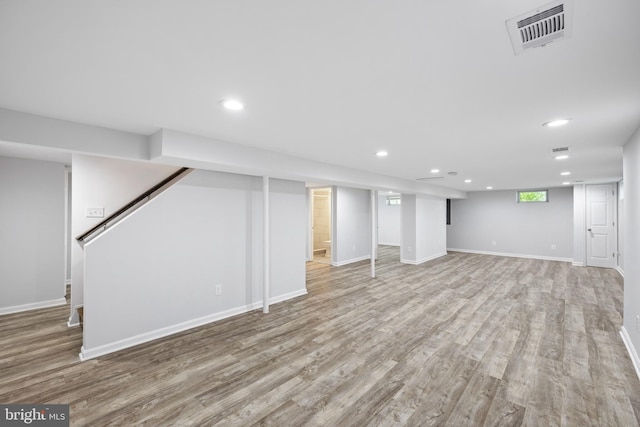 basement featuring light hardwood / wood-style flooring