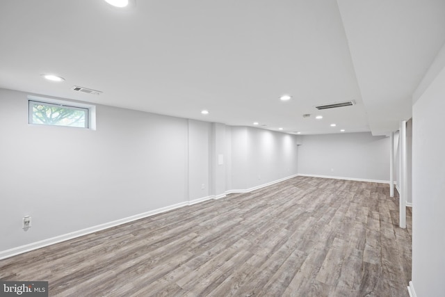 basement featuring light hardwood / wood-style floors