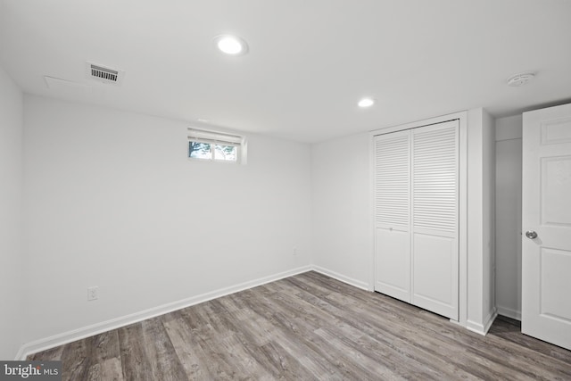 basement featuring light wood-type flooring