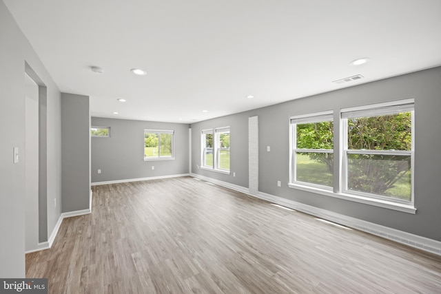 unfurnished living room with light hardwood / wood-style floors