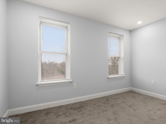 spare room with carpet, baseboards, and recessed lighting