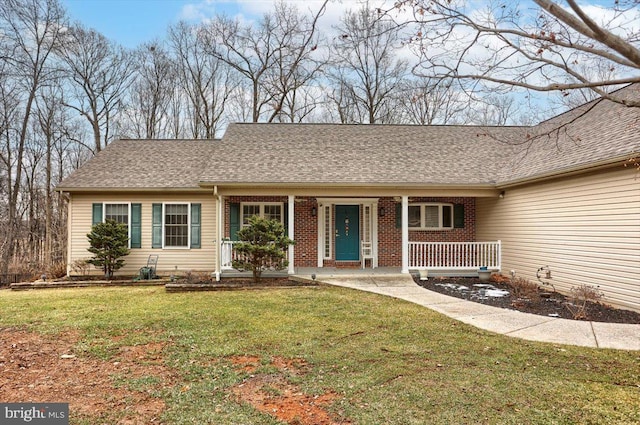 ranch-style house with a front lawn and covered porch