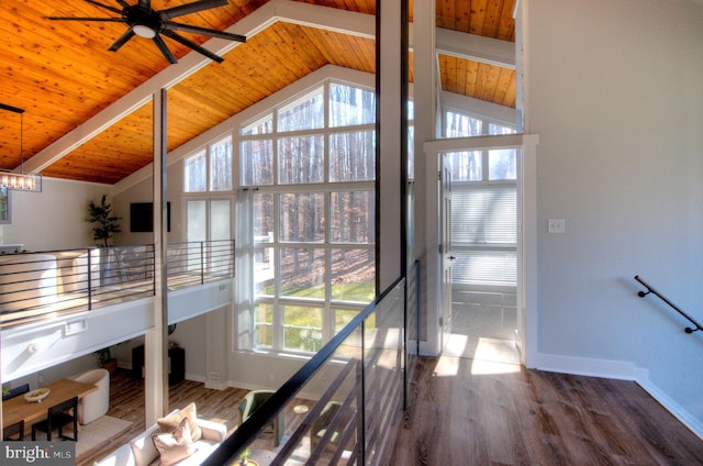 interior space with wood ceiling, dark hardwood / wood-style flooring, and lofted ceiling with beams