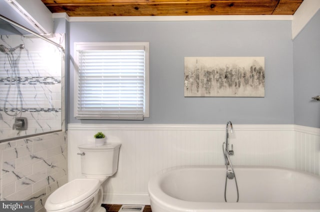 bathroom with a bathing tub and toilet