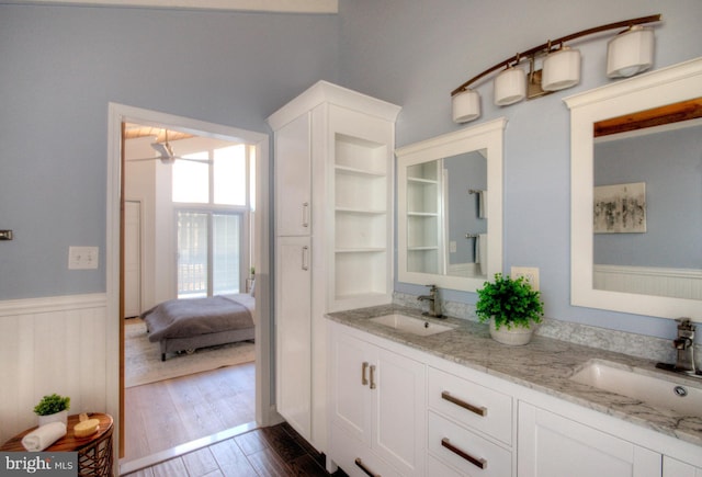 bathroom featuring vanity and wood-type flooring