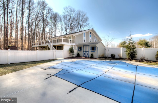 view of swimming pool with a patio