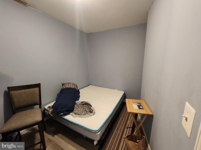 bedroom featuring wood-type flooring