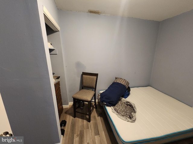 bedroom featuring wood-type flooring