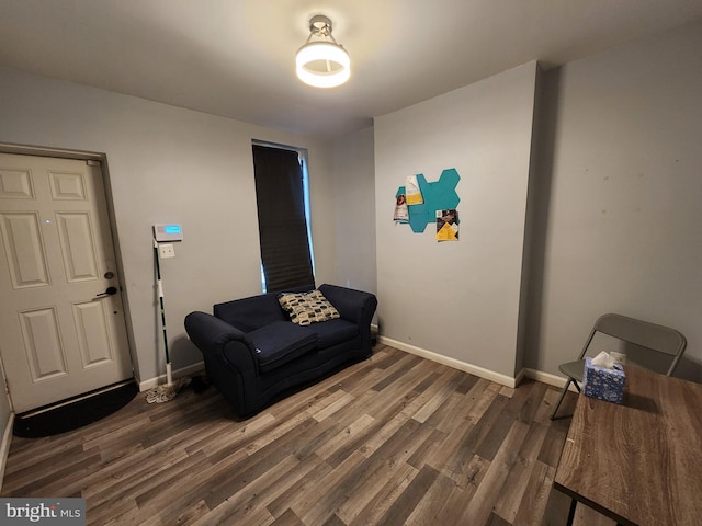 living area with dark hardwood / wood-style flooring