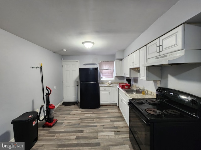 kitchen with white cabinetry, sink, black appliances, and light hardwood / wood-style floors