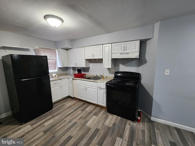 kitchen featuring white cabinetry, sink, black appliances, and dark hardwood / wood-style floors