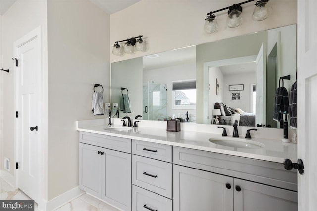 bathroom with marble finish floor, connected bathroom, and a sink