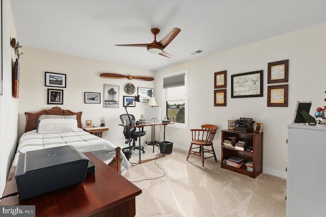 bedroom with light carpet, visible vents, and baseboards