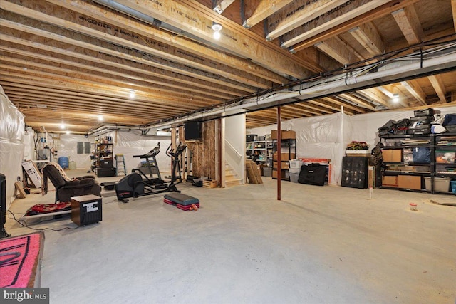 unfinished basement featuring stairway