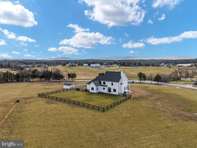 drone / aerial view featuring a rural view and a mountain view