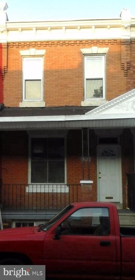 view of front of home featuring brick siding