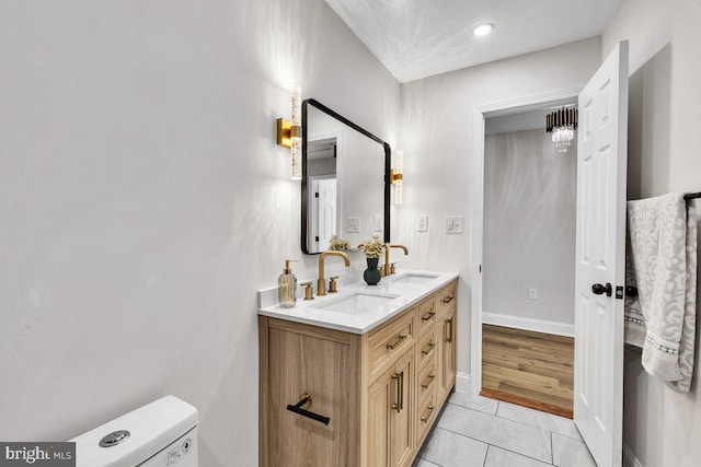 bathroom with vanity, tile patterned floors, and toilet