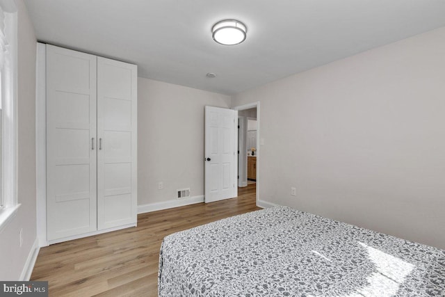 bedroom with light hardwood / wood-style floors