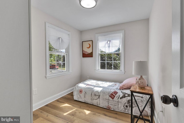 bedroom with light wood-type flooring