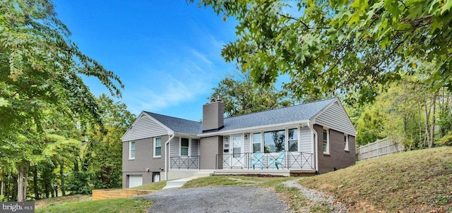 view of front of property with a garage