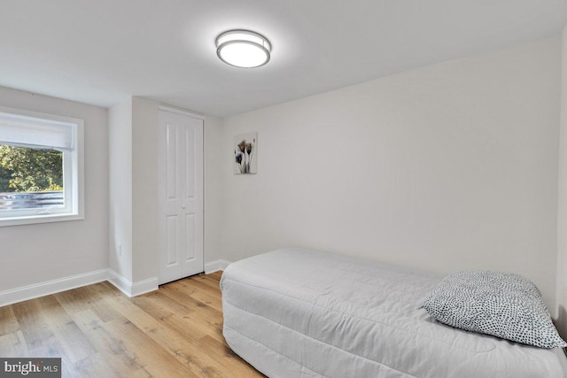 bedroom with hardwood / wood-style flooring