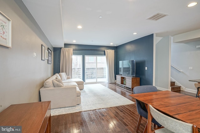 living room with dark hardwood / wood-style floors