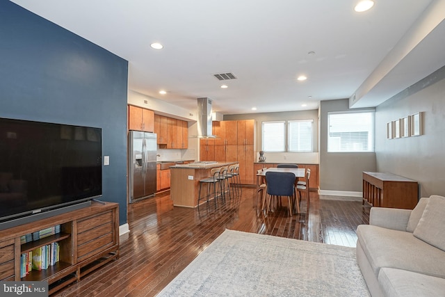 living room featuring dark hardwood / wood-style flooring