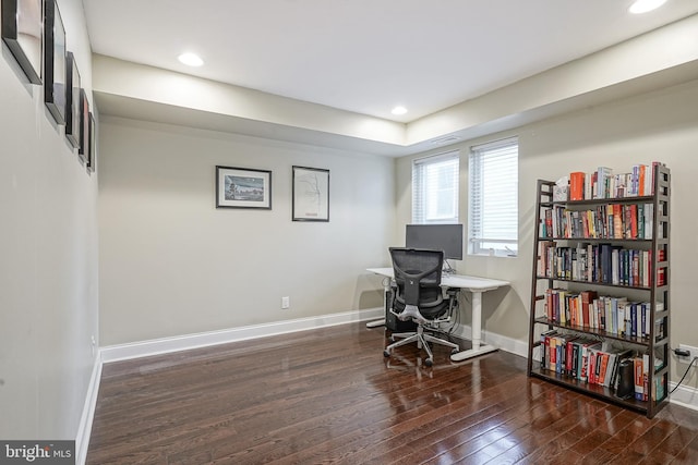 office space with dark hardwood / wood-style flooring