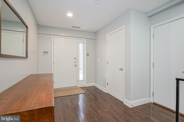 foyer entrance with dark hardwood / wood-style floors