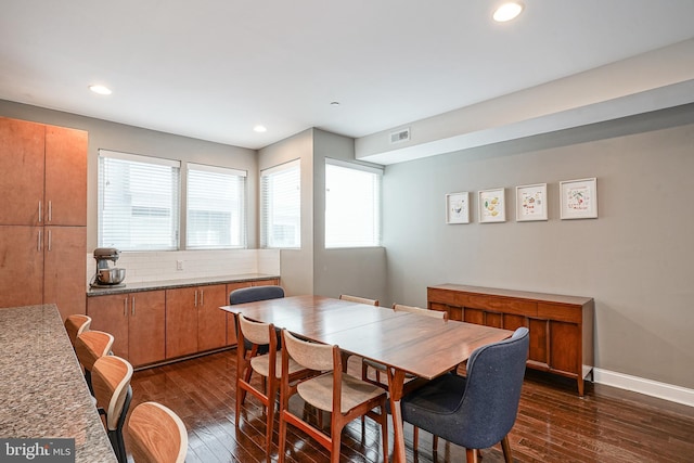 dining area featuring dark hardwood / wood-style flooring