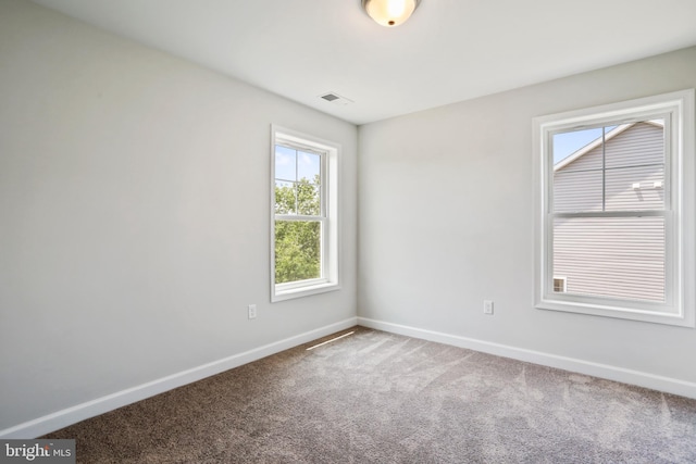 unfurnished room with carpet floors