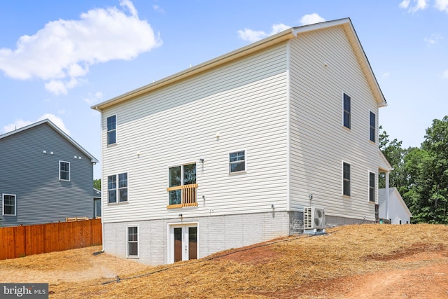 back of house with ac unit