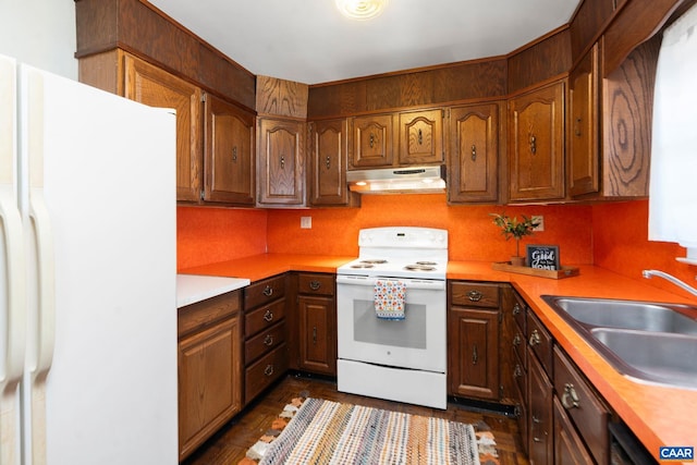 kitchen with white appliances and sink