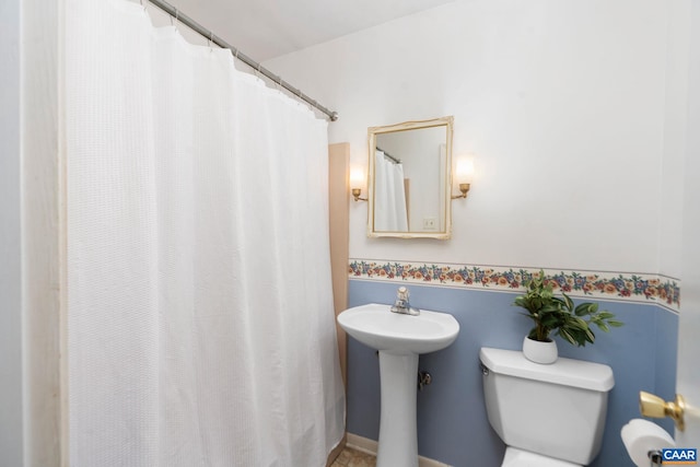 bathroom featuring sink and toilet