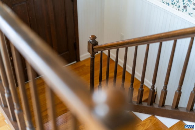 staircase with wood-type flooring