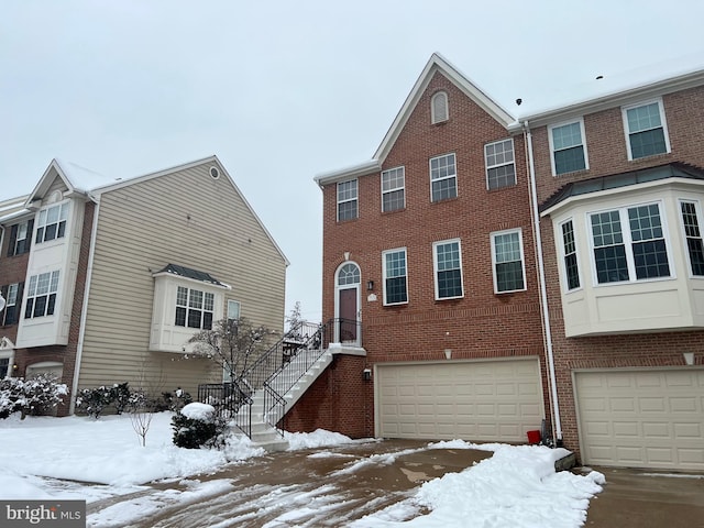 multi unit property featuring a garage