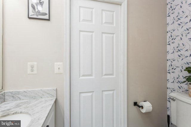 bathroom with vanity and toilet