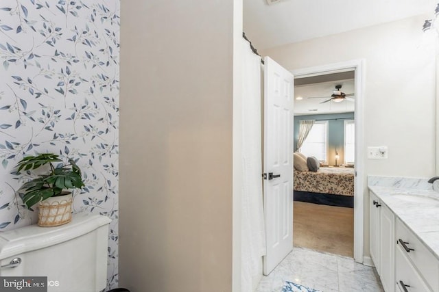 bathroom featuring a shower with curtain, vanity, and toilet