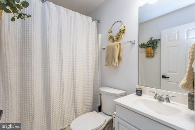 full bathroom with vanity, toilet, and shower / bath combo with shower curtain