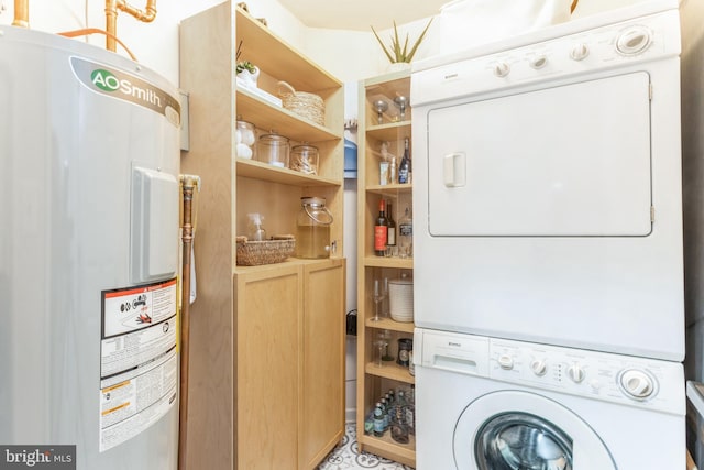 laundry room featuring stacked washer and dryer and water heater