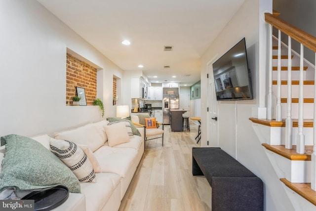 living room with light hardwood / wood-style flooring