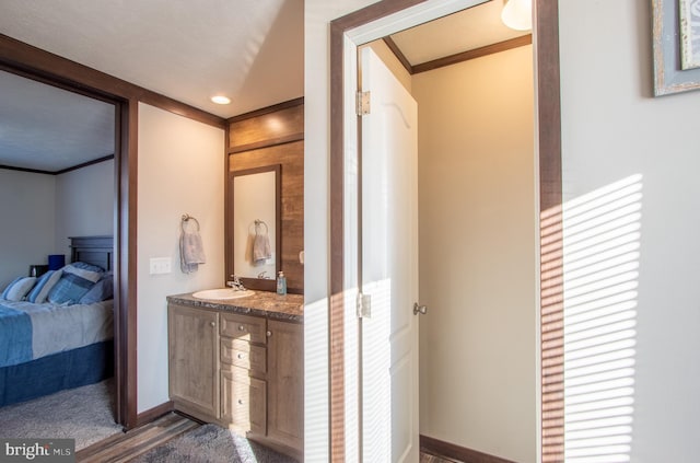 bathroom with vanity and ornamental molding