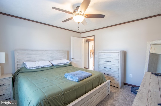 carpeted bedroom with crown molding and ceiling fan