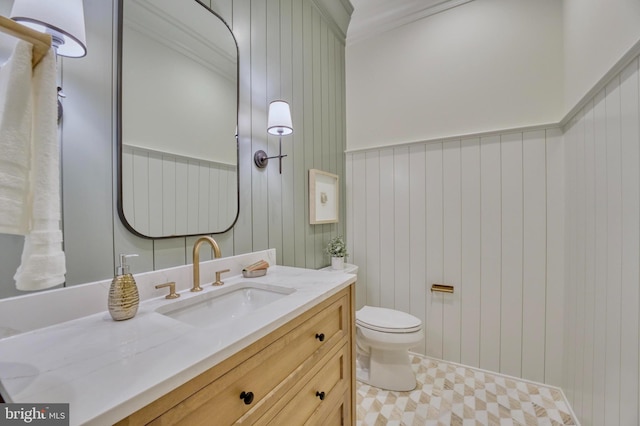 bathroom featuring toilet, tile patterned floors, and vanity